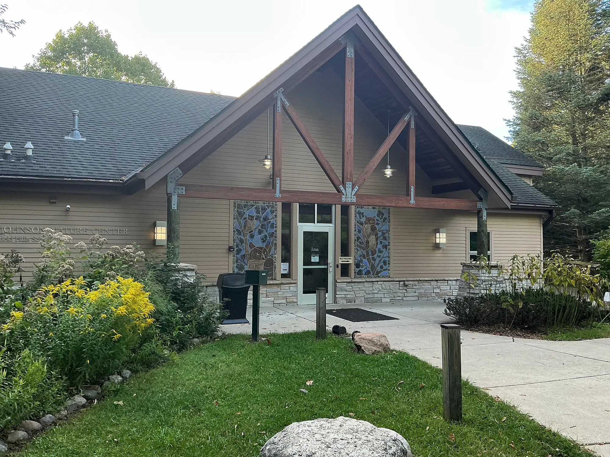 Front of the E.L. Johnson Nature Center with gardens along the walk