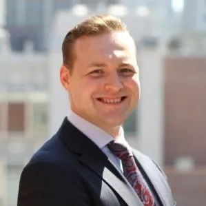 Leonard Wheeler, in a dark suit and tie